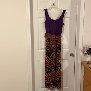 Purple dress with multi colors on bottom with belt.